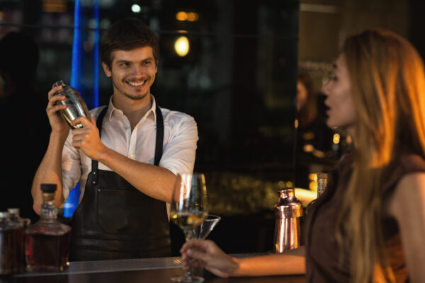 Cheerful,Young,Handsome,Male,Bartender,Smiling,Joyfully,While,Preparing,A
