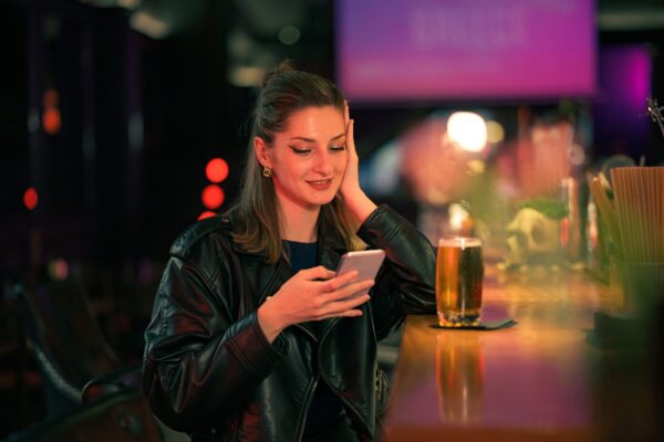 A,Young,Woman,In,A,Leather,Jacket,Is,At,A