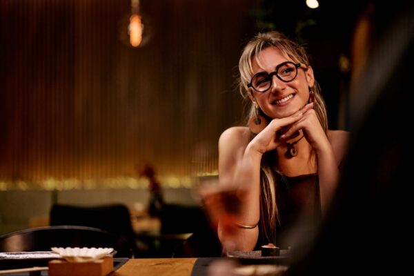 A,Cheerful,Woman,Wearing,Glasses,Smiles,,Enjoying,A,Pleasant,Evening